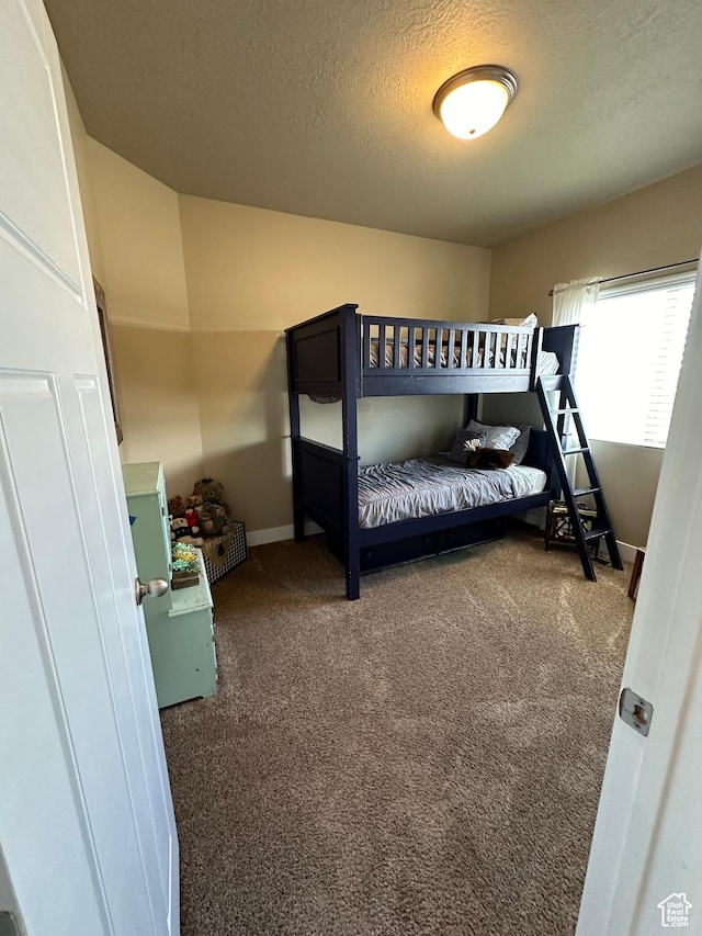 338 S 1230 E, Tooele, UT 84074 - bedroom with a textured ceiling, baseboards, and carpet floors