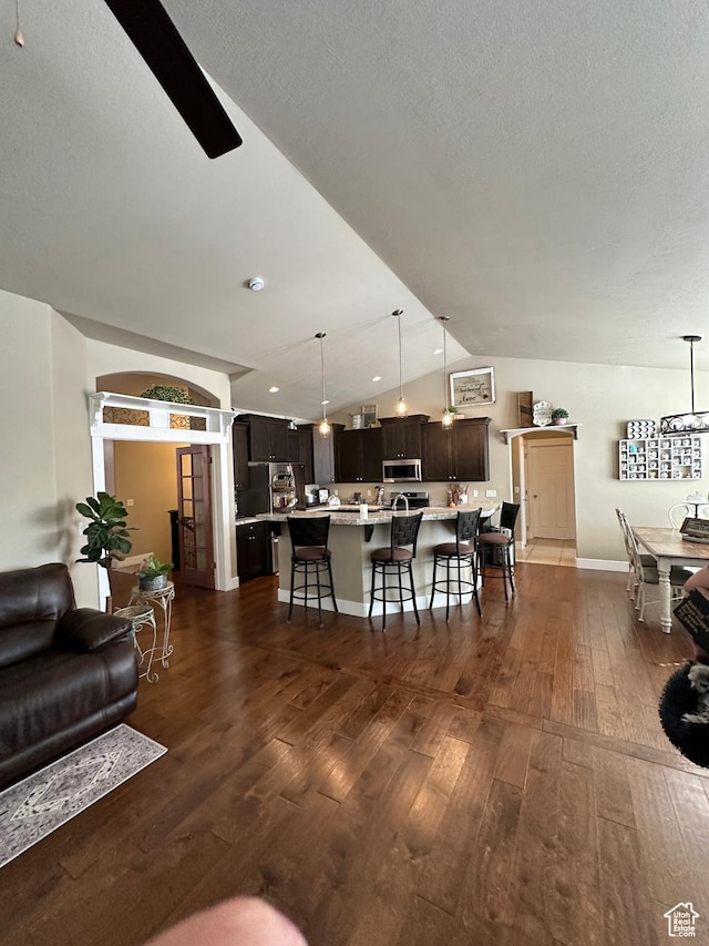 338 S 1230 E, Tooele, UT 84074 - living room with dark wood finished floors, a textured ceiling, and lofted ceiling