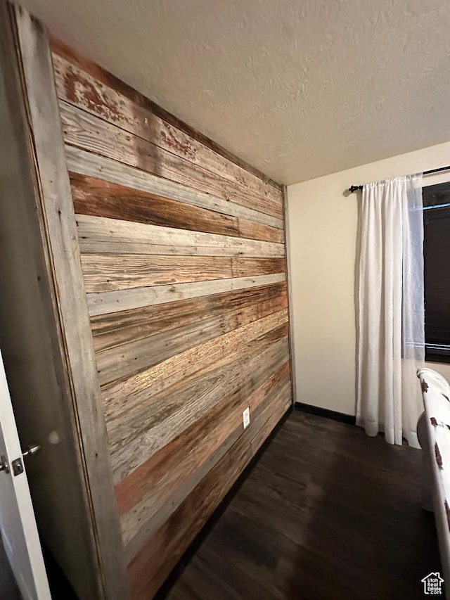 338 S 1230 E, Tooele, UT 84074 - interior space featuring wood walls, wood finished floors, and a textured ceiling