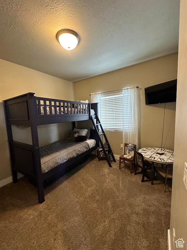 338 S 1230 E, Tooele, UT 84074 - bedroom featuring a textured ceiling, baseboards, and carpet