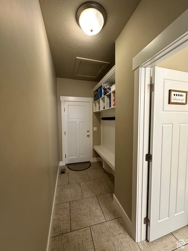 338 S 1230 E, Tooele, UT 84074 - interior space with baseboards, a textured ceiling, and attic access