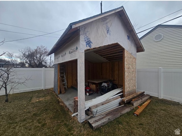 777 Simoron Dr, Ogden, UT 84404 - view of pole building featuring a garage, a yard, and a fenced backyard