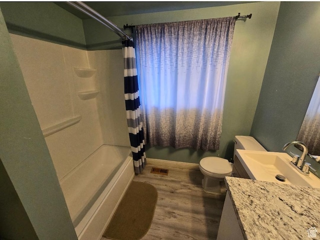777 Simoron Dr, Ogden, UT 84404 - bathroom with shower / bath combo, toilet, vanity, and wood finished floors