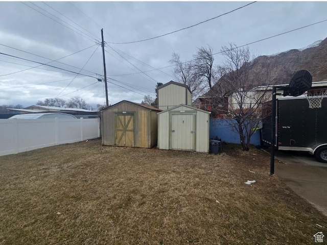777 Simoron Dr, Ogden, UT 84404 - view of yard featuring an outbuilding, fence, and a shed