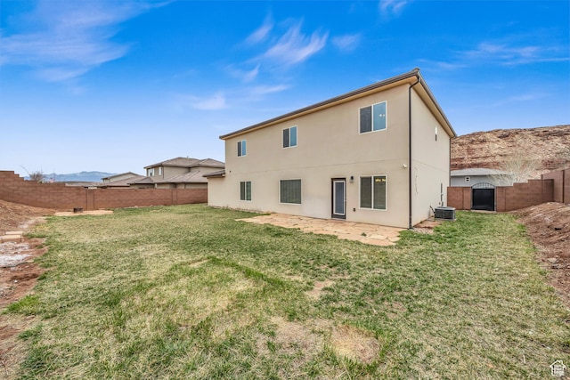 6116 S Rocky Talus Way, St George, UT 84790 - back of property with central AC unit, a fenced backyard, a yard, a gate, and stucco siding
