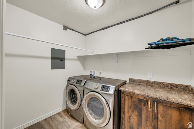 6116 S Rocky Talus Way, St George, UT 84790 - washroom with washing machine and clothes dryer, a textured ceiling, light wood-type flooring, electric panel, and baseboards