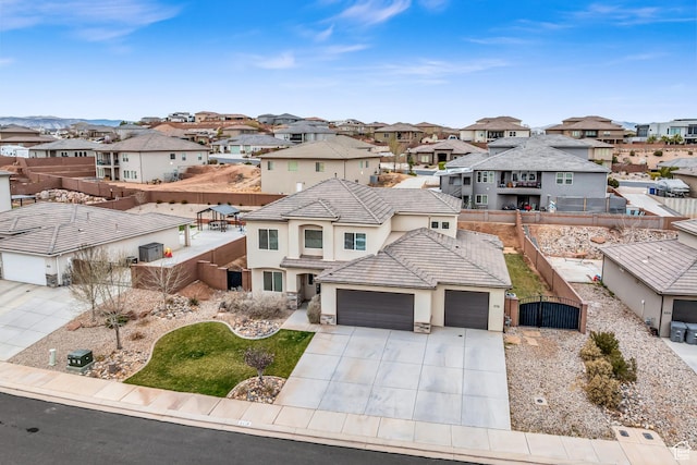 6116 S Rocky Talus Way, St George, UT 84790 - view of front of property featuring a garage, driveway, a residential view, a gate, and fence