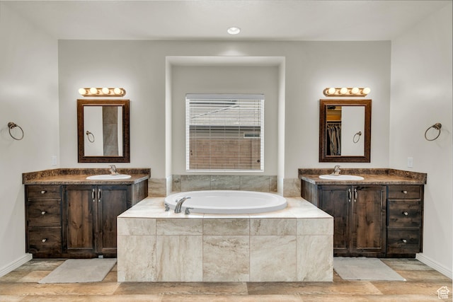 6116 S Rocky Talus Way, St George, UT 84790 - bathroom with two vanities, a sink, and a bath