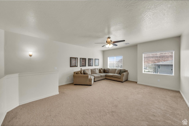 6116 S Rocky Talus Way, St George, UT 84790 - living room with ceiling fan, a textured ceiling, light carpet, visible vents, and baseboards
