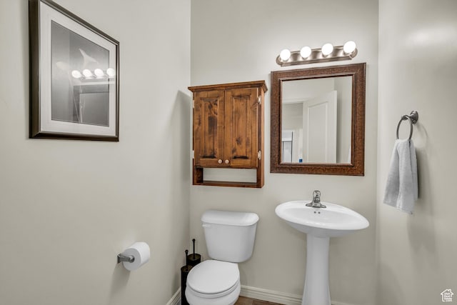 6116 S Rocky Talus Way, St George, UT 84790 - half bathroom with a sink, toilet, and baseboards