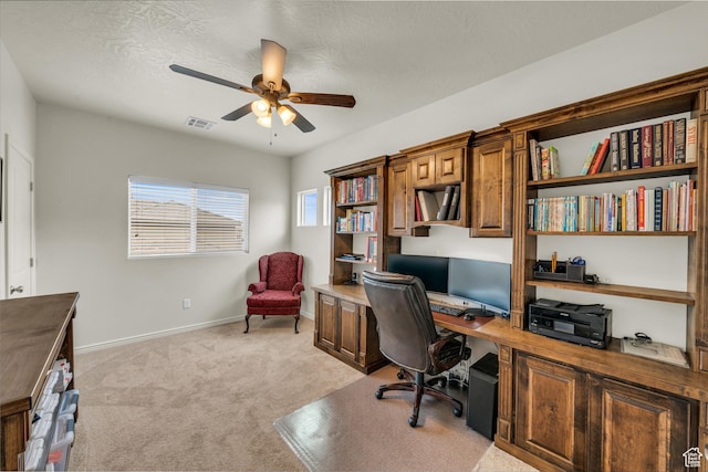 6116 S Rocky Talus Way, St George, UT 84790 - office area with light colored carpet, visible vents, a ceiling fan, a textured ceiling, and baseboards