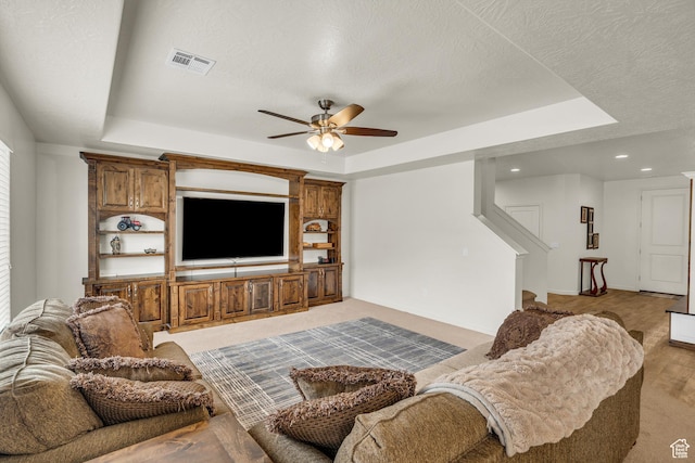 6116 S Rocky Talus Way, St George, UT 84790 - living area featuring a tray ceiling, visible vents, and a textured ceiling