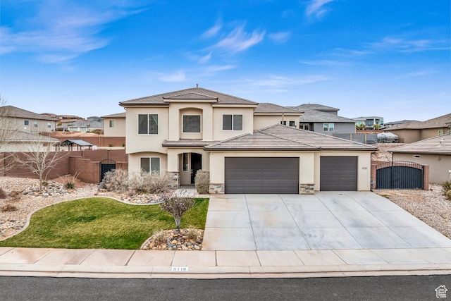 6116 S Rocky Talus Way, St George, UT 84790 - prairie-style house featuring stucco siding, an attached garage, a gate, fence, and stone siding