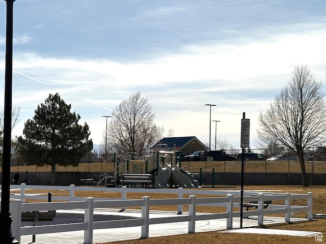community jungle gym featuring fence