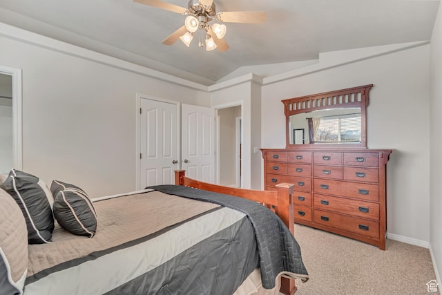 bedroom featuring vaulted ceiling, carpet flooring, baseboards, and ceiling fan