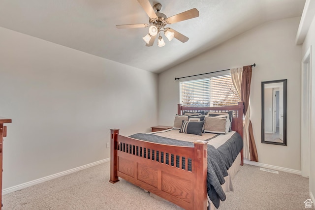 carpeted bedroom with visible vents, ceiling fan, baseboards, and vaulted ceiling