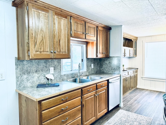 350 S 200 E, Ephraim, UT 84627 - kitchen featuring brown cabinets, dark wood finished floors, light countertops, a sink, and dishwashing machine