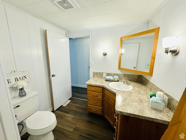 350 S 200 E, Ephraim, UT 84627 - bathroom featuring visible vents, vanity, toilet, and wood finished floors
