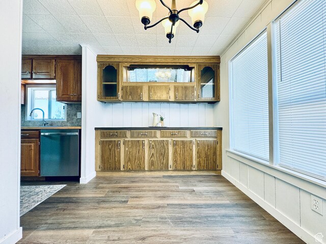 350 S 200 E, Ephraim, UT 84627 - kitchen with dishwasher, a sink, wood finished floors, and a chandelier