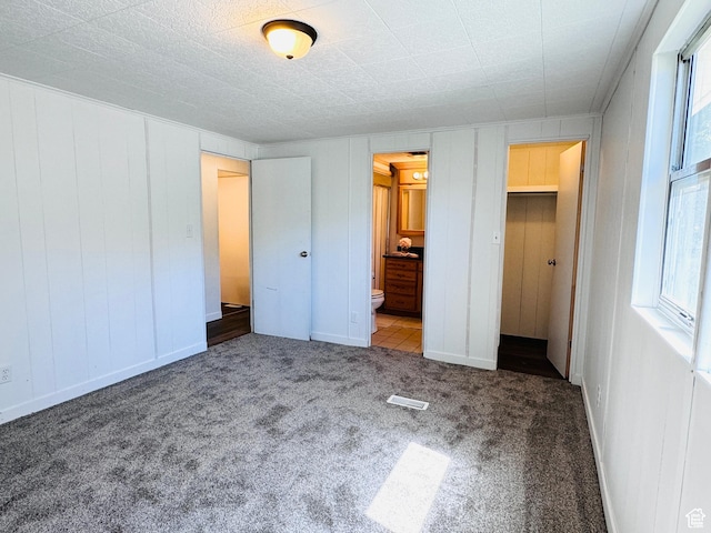 350 S 200 E, Ephraim, UT 84627 - unfurnished bedroom featuring carpet floors, visible vents, and ensuite bathroom