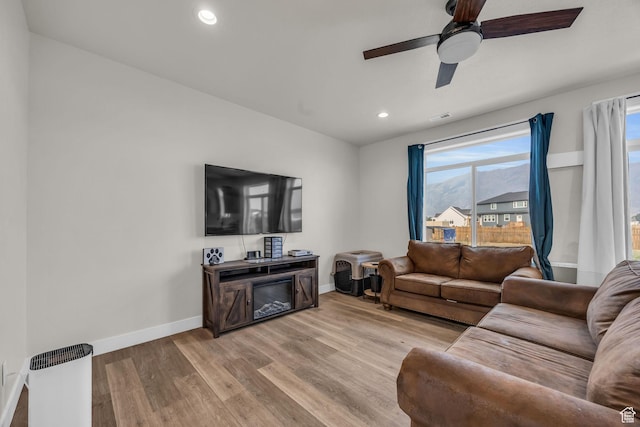 9444 N 4800 W, Elwood, UT 84337 - living room with baseboards, light wood finished floors, ceiling fan, and recessed lighting