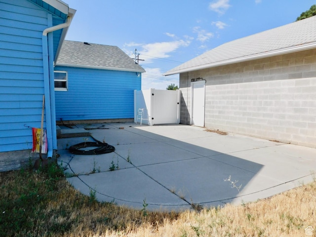 1660 W 700 S, Marriott Slaterville, UT 84404 - view of patio / terrace with driveway and a gate