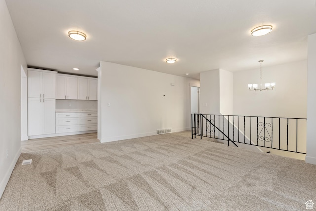 980 W 230 N, Orem, UT 84057 - empty room with light carpet, a chandelier, and baseboards