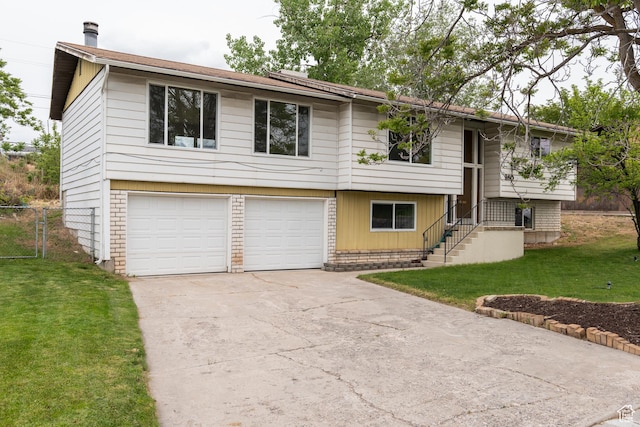 980 W 230 N, Orem, UT 84057 - split foyer home with concrete driveway and an attached garage