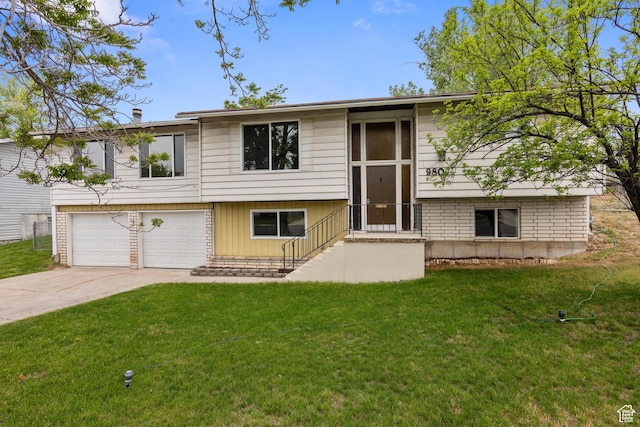 980 W 230 N, Orem, UT 84057 - split foyer home featuring concrete driveway, a garage, and a front lawn