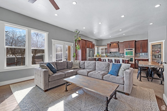 1137 S 925 E, Salem, UT 84653 - living room with light wood-style flooring, recessed lighting, baseboards, and french doors