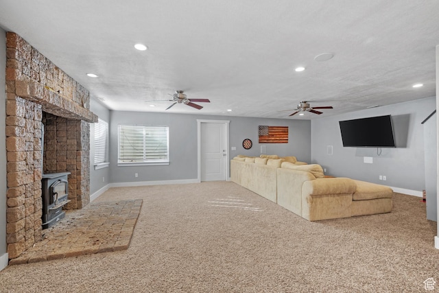 1137 S 925 E, Salem, UT 84653 - unfurnished living room featuring carpet, ceiling fan, a wood stove, and a textured ceiling