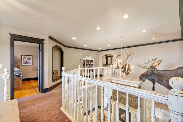 3250 W 1150 N, Roosevelt, UT 84066 - corridor with baseboards, ornamental molding, recessed lighting, an inviting chandelier, and arched walkways