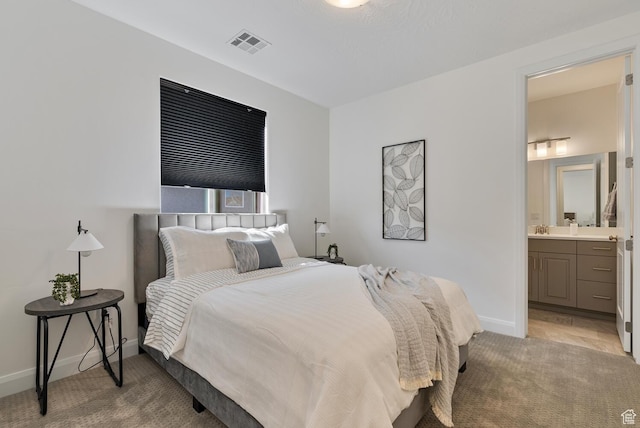 1392 N Marfil Way, Washington, UT 84780 - bedroom with visible vents, ensuite bathroom, a sink, baseboards, and light colored carpet