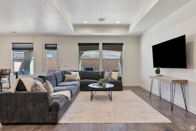 1392 N Marfil Way, Washington, UT 84780 - living room with visible vents, baseboards, a tray ceiling, a textured ceiling, and wood-type flooring