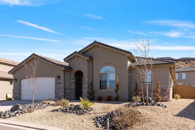 view of front facade featuring stucco siding and stone siding