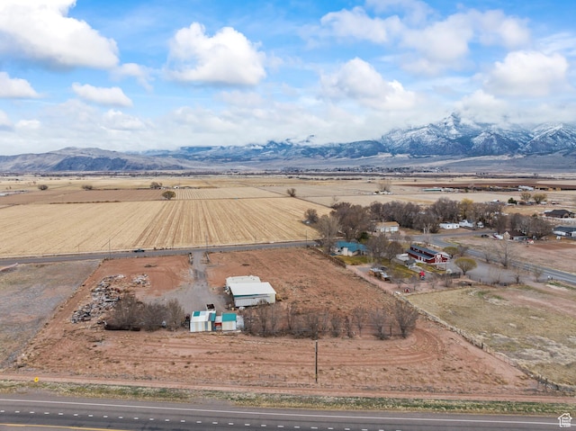 drone / aerial view featuring a rural view and a mountain view