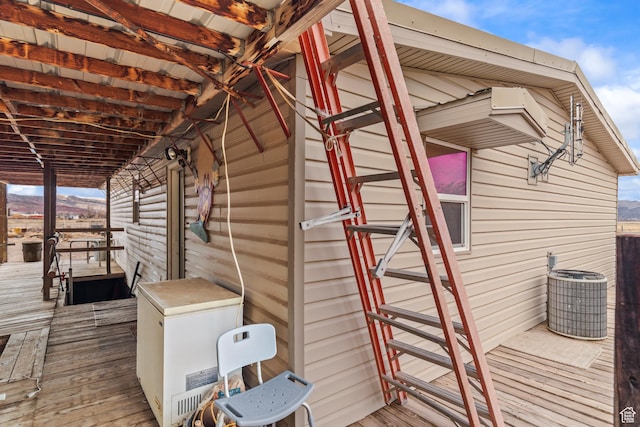 wooden deck with central AC unit