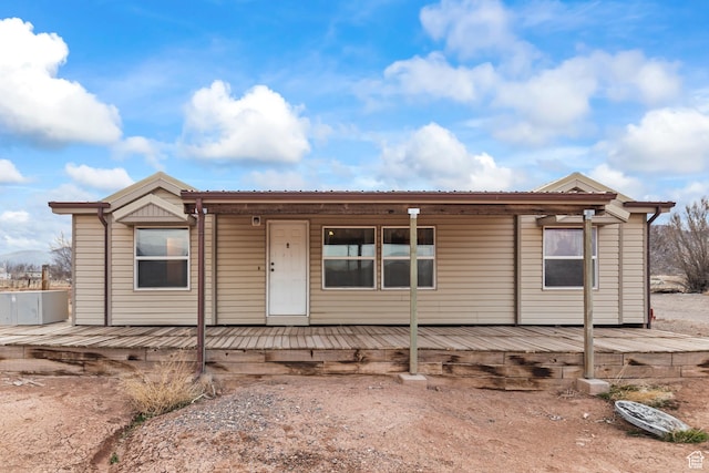 view of front of house featuring a wooden deck