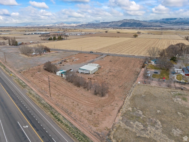 birds eye view of property featuring a mountain view and a rural view