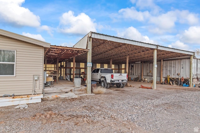 view of parking with a carport