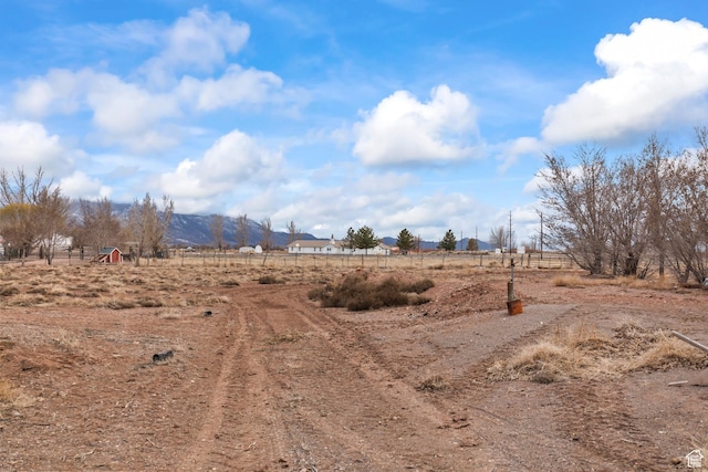 view of yard with a rural view