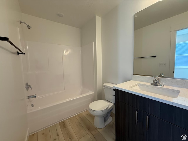 3269 S 1000 W, Nibley, UT 84321 - bathroom featuring vanity, washtub / shower combination, toilet, and wood finished floors