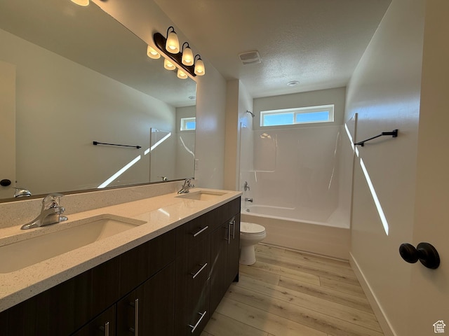 3269 S 1000 W, Nibley, UT 84321 - full bathroom featuring a sink, tub / shower combination, wood finished floors, and double vanity