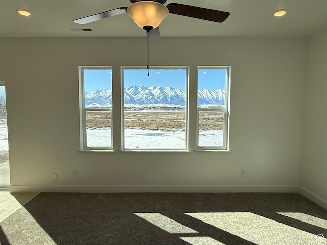 3269 S 1000 W, Nibley, UT 84321 - carpeted spare room featuring a wealth of natural light, visible vents, a mountain view, and baseboards