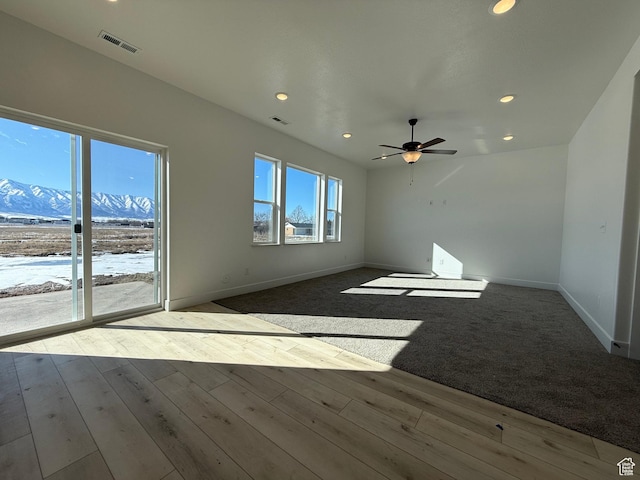 3269 S 1000 W, Nibley, UT 84321 - unfurnished room featuring wood finished floors, visible vents, and baseboards