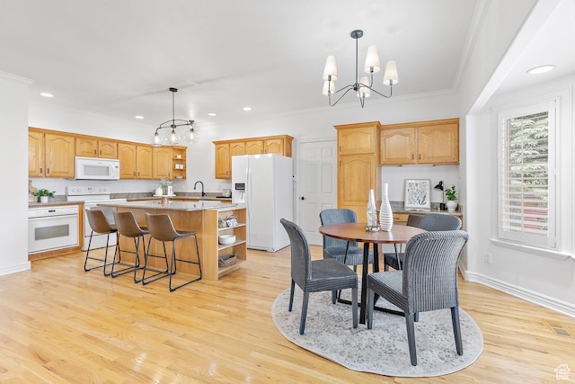539 E Normandy Dr, Provo, UT 84604 - dining space with light wood-style flooring, crown molding, baseboards, recessed lighting, and a notable chandelier