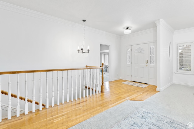 539 E Normandy Dr, Provo, UT 84604 - entrance foyer with baseboards, crown molding, a notable chandelier, and wood finished floors