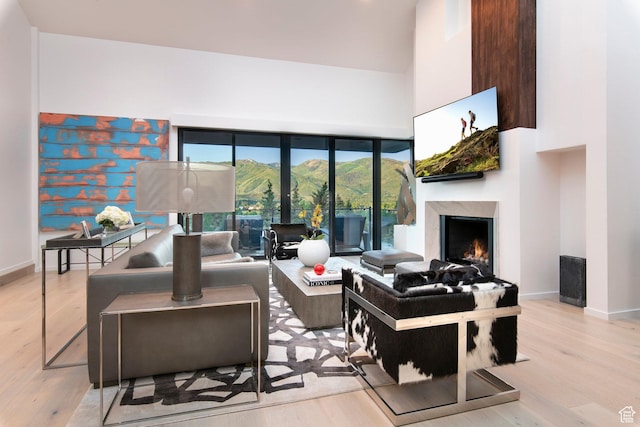 2559 Lupine Ln, Park City, UT 84060 - living area with a high end fireplace, wood finished floors, and a towering ceiling