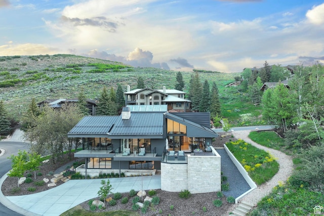2559 Lupine Ln, Park City, UT 84060 - back of property with a metal roof, a standing seam roof, stairway, and driveway