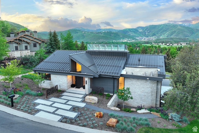 2559 Lupine Ln, Park City, UT 84060 - view of front of home with a standing seam roof, stone siding, a mountain view, and a metal roof